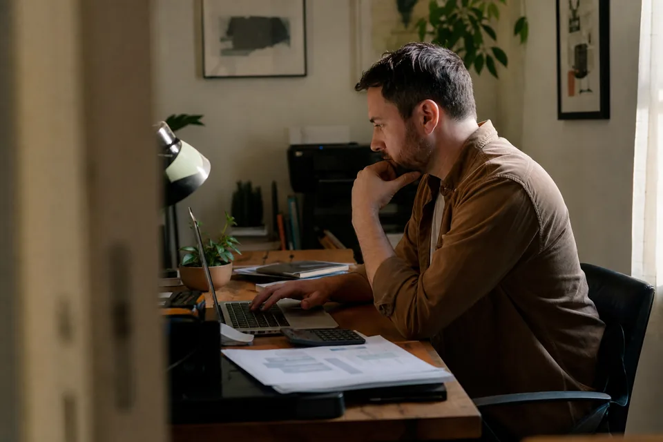 Sales operations lead reviewing a monthly prospecting credit budget on a laptop